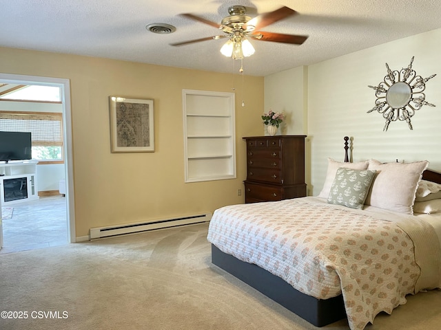bedroom featuring a textured ceiling, carpet, baseboards, a baseboard heating unit, and visible vents