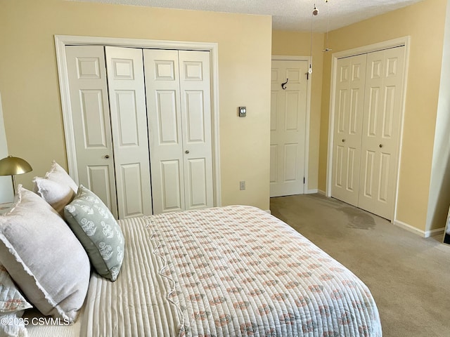 bedroom featuring carpet floors and baseboards