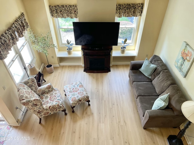 living room featuring baseboards and wood finished floors