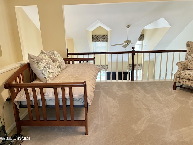 living area with ceiling fan and carpet