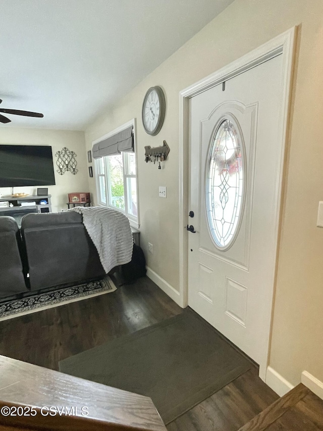 entryway with baseboards, dark wood-style flooring, and ceiling fan