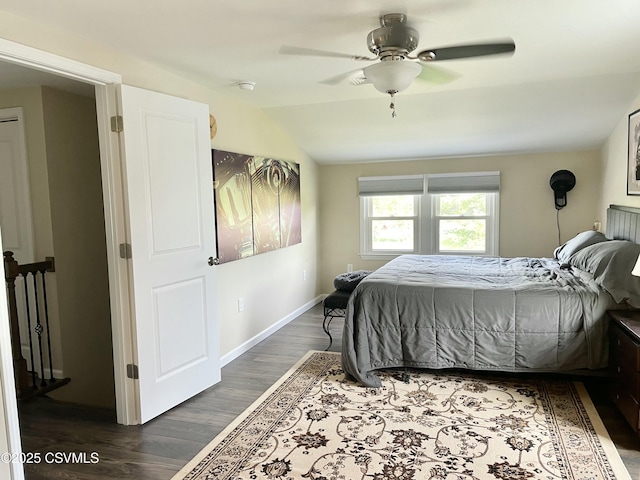 bedroom featuring ceiling fan, baseboards, vaulted ceiling, and wood finished floors