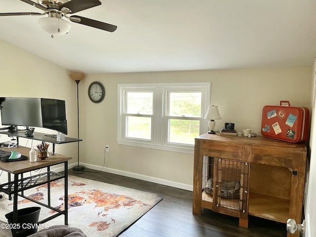 office featuring a ceiling fan, baseboards, and wood finished floors