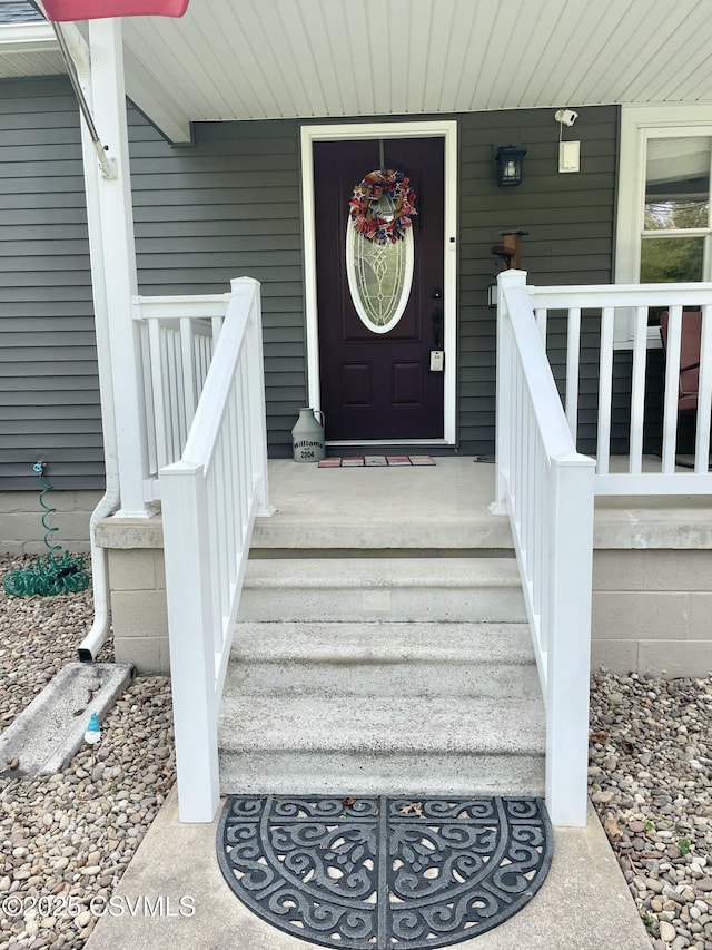 doorway to property featuring a porch