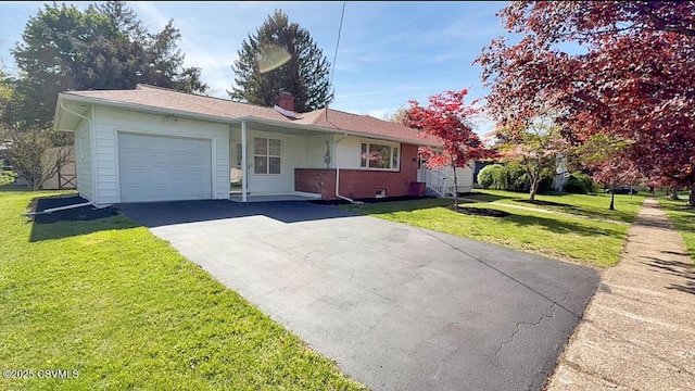 125 Knights Dr, Bloomsburg, PA 17815 - ranch-style home with an attached garage, a front lawn, driveway, and a chimney