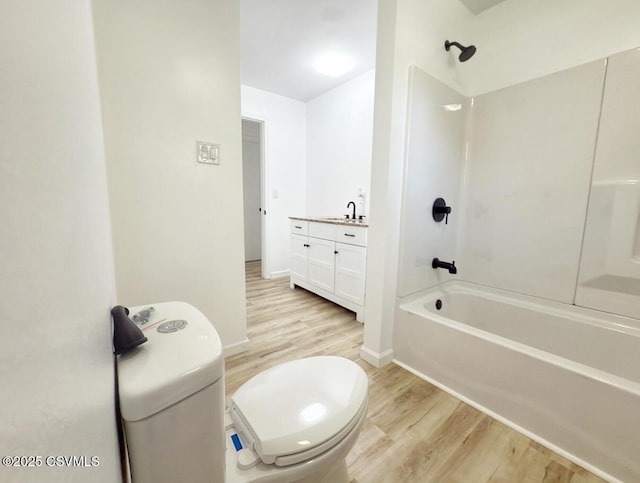 125 Knights Dr, Bloomsburg, PA 17815 - bathroom with vanity, wood finished floors, toilet, bathing tub / shower combination, and baseboards