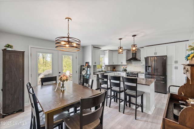 31 Holly Ct, Danville, PA 17821 - dining space with light wood finished floors, a chandelier, and french doors