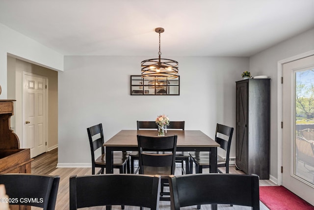 31 Holly Ct, Danville, PA 17821 - dining space featuring a notable chandelier, baseboards, and light wood-style floors