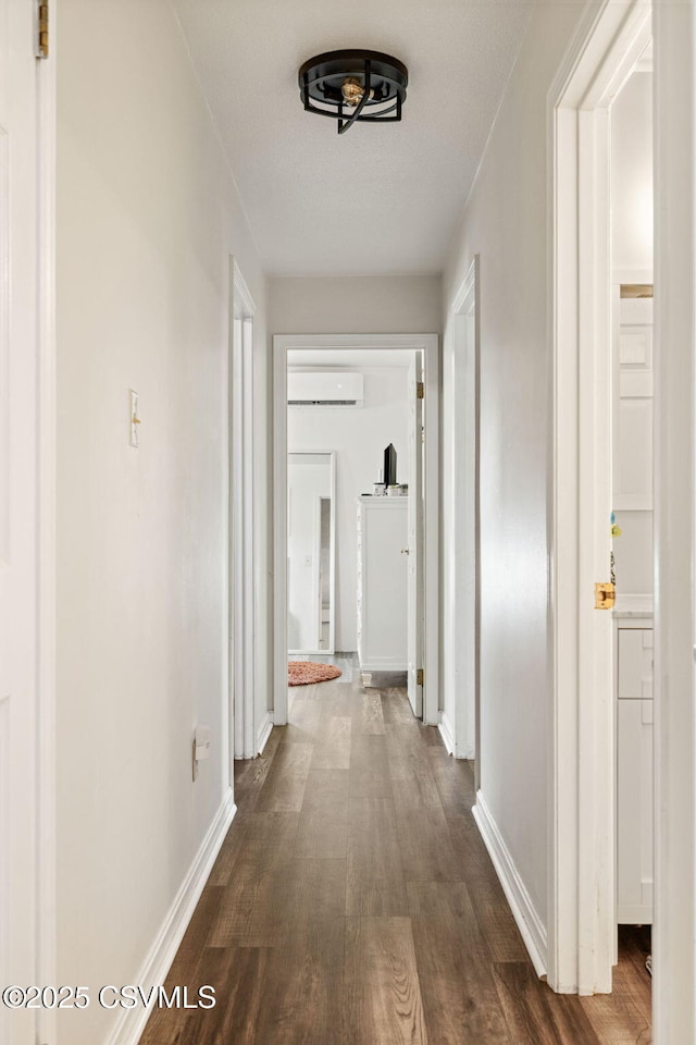 31 Holly Ct, Danville, PA 17821 - corridor with dark wood-type flooring, baseboards, and a wall unit AC