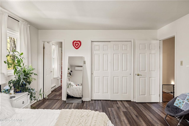 31 Holly Ct, Danville, PA 17821 - bedroom featuring a wall mounted air conditioner, a closet, baseboard heating, and dark wood-style floors