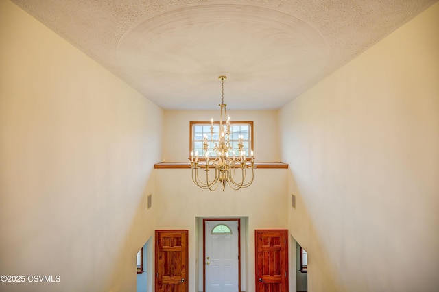 foyer with a chandelier
