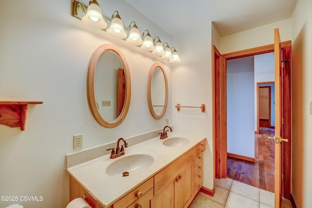 bathroom with tile patterned flooring and double vanity