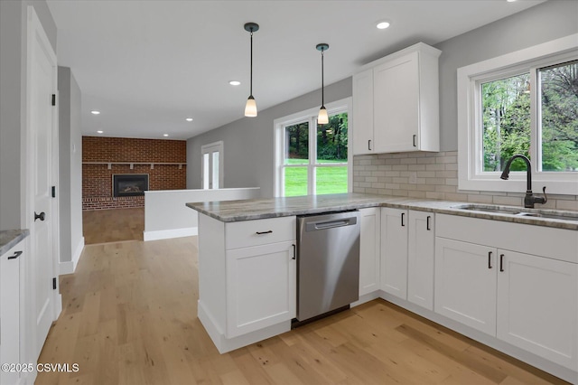 92 Valley View Rd, Lewisburg, PA 17837 - kitchen featuring a wealth of natural light, light wood-style flooring, a sink, and stainless steel dishwasher