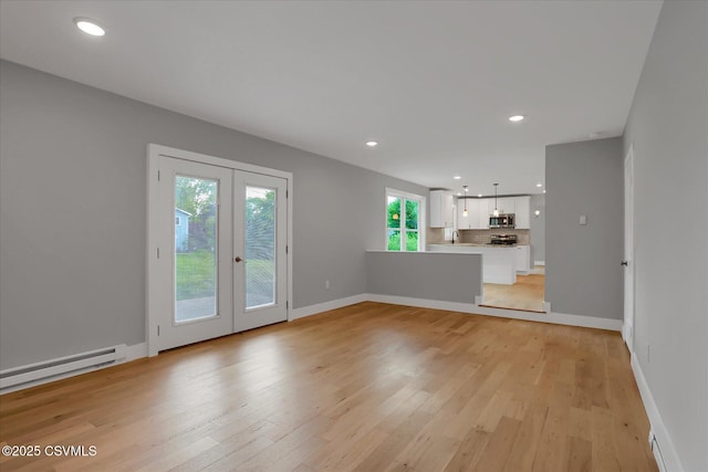 92 Valley View Rd, Lewisburg, PA 17837 - unfurnished living room with french doors, recessed lighting, and light wood-style flooring