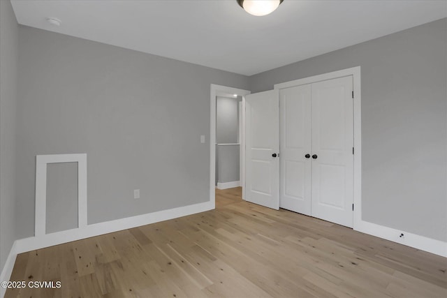 92 Valley View Rd, Lewisburg, PA 17837 - unfurnished bedroom with baseboards, a closet, and wood finished floors