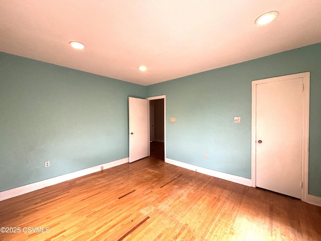 735 E 3rd St, Bloomsburg, PA 17815 - unfurnished bedroom featuring baseboards, wood finished floors, and recessed lighting