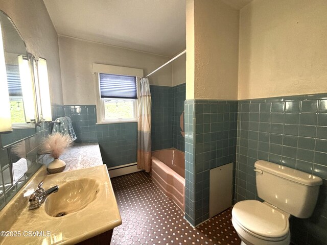 735 E 3rd St, Bloomsburg, PA 17815 - full bathroom featuring tile walls, toilet, vanity, shower / bath combo, and wainscoting