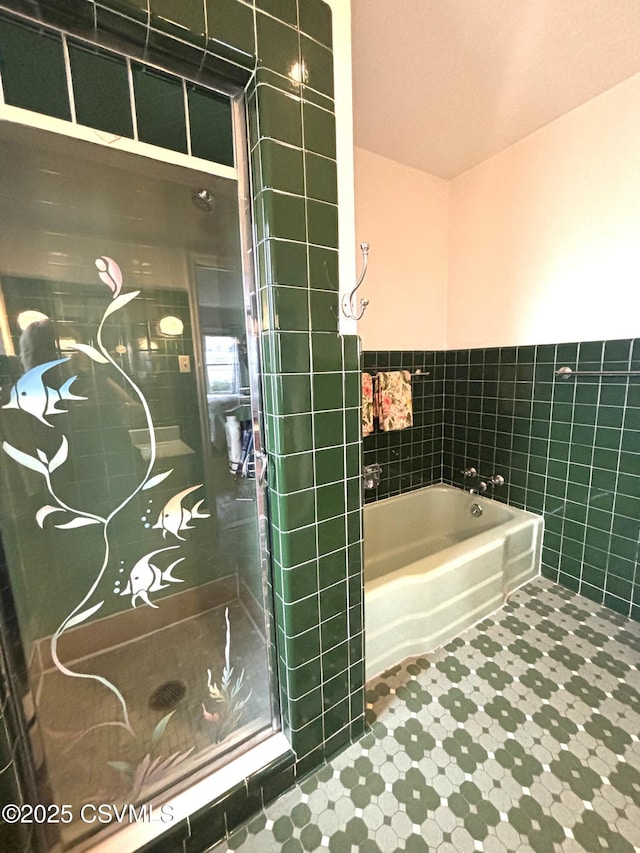 735 E 3rd St, Bloomsburg, PA 17815 - full bath with tile walls, a garden tub, a stall shower, a wainscoted wall, and tile patterned floors