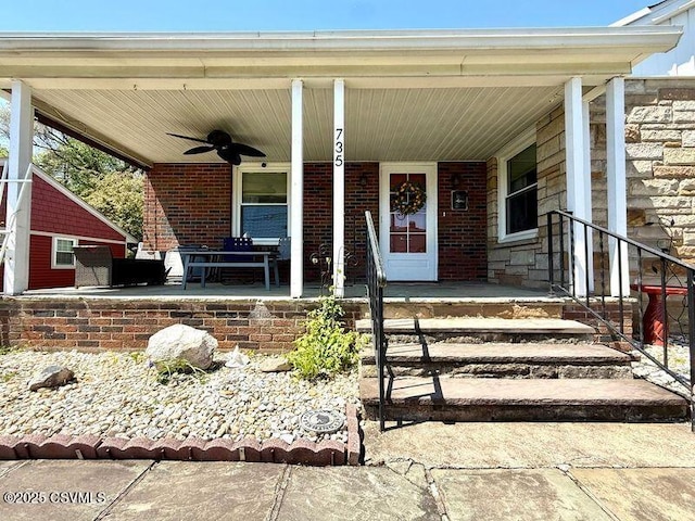 735 E 3rd St, Bloomsburg, PA 17815 - view of exterior entry featuring a ceiling fan, covered porch, and brick siding