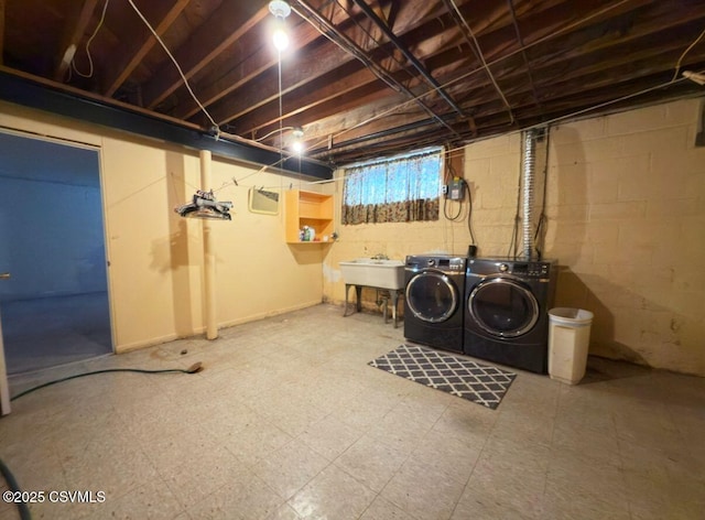 735 E 3rd St, Bloomsburg, PA 17815 - below grade area featuring independent washer and dryer, tile patterned floors, and a sink