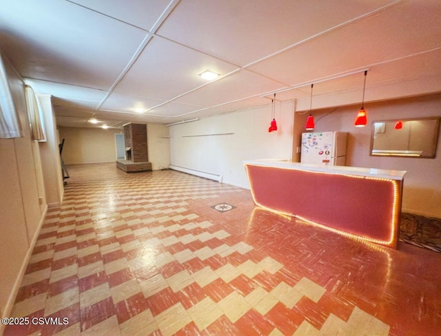 735 E 3rd St, Bloomsburg, PA 17815 - bar area featuring tile patterned floors, freestanding refrigerator, baseboards, and a baseboard radiator