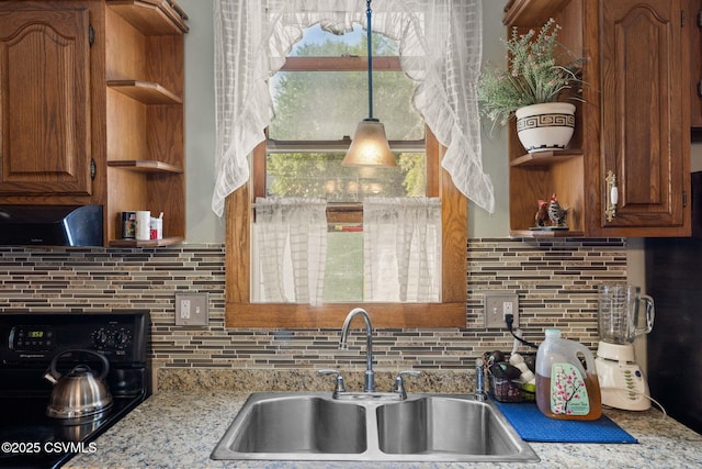 341 Dewart St, Danville, PA 17821 - kitchen featuring open shelves, a sink, decorative backsplash, and brown cabinets