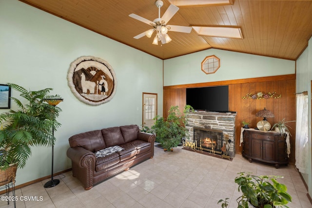 341 Dewart St, Danville, PA 17821 - tiled living area with vaulted ceiling, wooden ceiling, ceiling fan, a fireplace, and wood walls