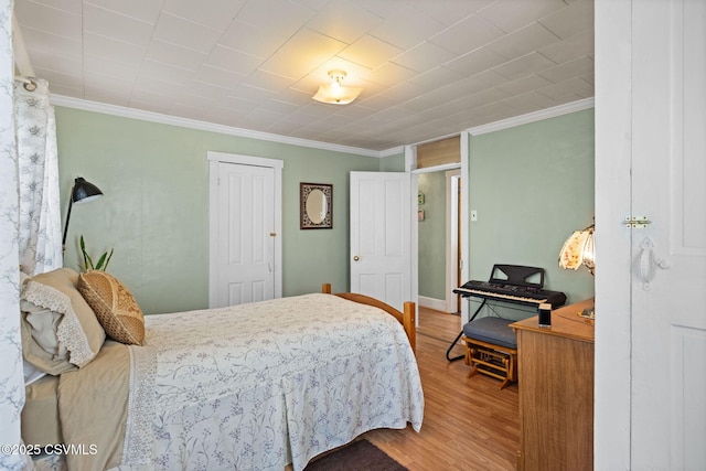 341 Dewart St, Danville, PA 17821 - bedroom featuring ornamental molding, wood finished floors, a closet, and baseboards