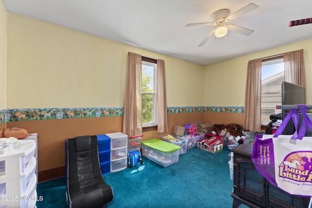 276 3rd St, New Columbia, PA 17856 - playroom featuring carpet, ceiling fan, and wainscoting