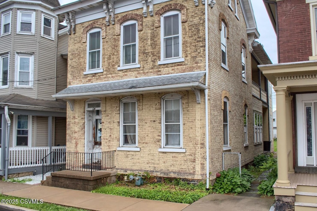 124 S 4th St, Sunbury, PA 17801 - view of front of home with brick siding and a shingled roof