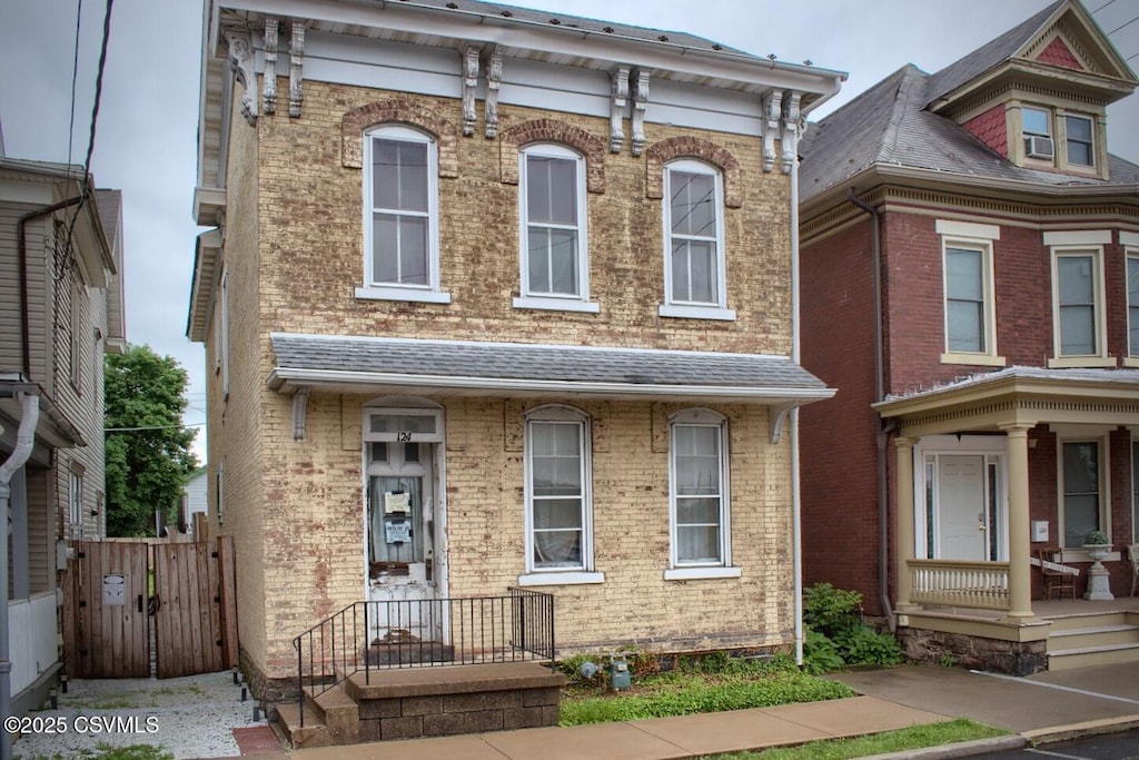124 S 4th St, Sunbury, PA 17801 - view of front of property featuring brick siding and a gate