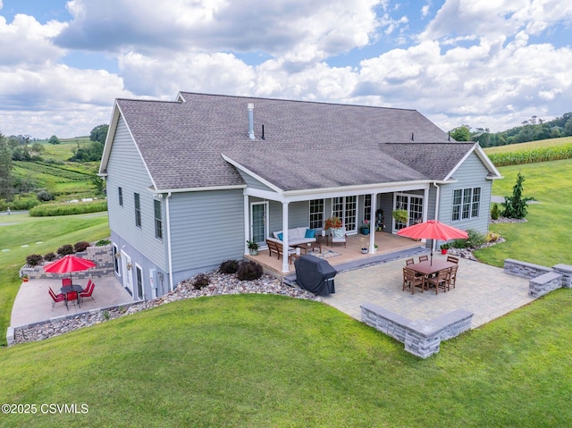 357 Lick Run Rd, Bloomsburg, PA 17815 - back of property with a wooden deck, a shingled roof, a yard, an outdoor hangout area, and a patio area