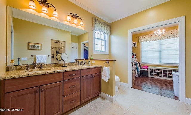 357 Lick Run Rd, Bloomsburg, PA 17815 - bathroom featuring ornamental molding, toilet, tile patterned floors, double vanity, and baseboards