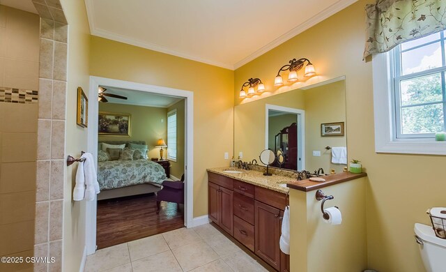357 Lick Run Rd, Bloomsburg, PA 17815 - full bathroom featuring connected bathroom, crown molding, tile patterned floors, double vanity, and toilet