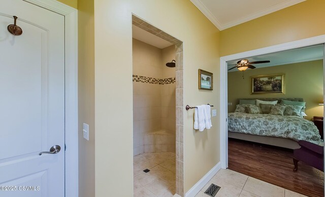 357 Lick Run Rd, Bloomsburg, PA 17815 - ensuite bathroom with tile patterned flooring, tiled shower, crown molding, ceiling fan, and baseboards