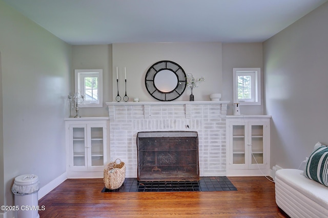 120 Geise St, Sunbury, PA 17801 - living area featuring a fireplace, plenty of natural light, baseboards, and wood finished floors