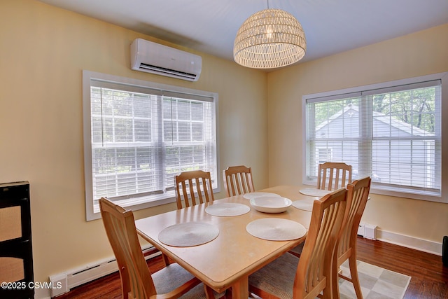120 Geise St, Sunbury, PA 17801 - dining space featuring an AC wall unit, wood finished floors, and a chandelier
