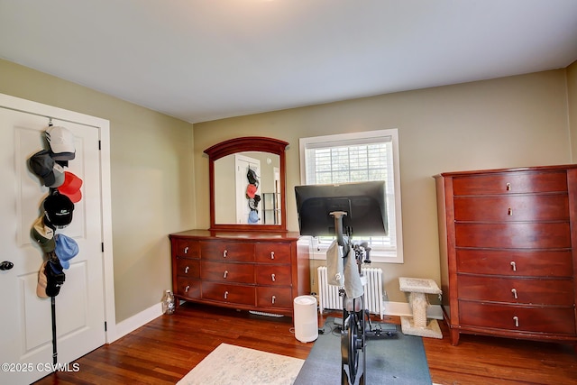 120 Geise St, Sunbury, PA 17801 - workout area featuring dark wood finished floors, radiator, and baseboards