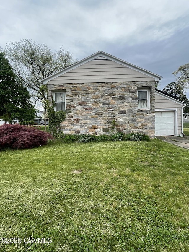 514 E 5th St, Berwick, PA 18603 - view of side of home with a yard, stone siding, and driveway