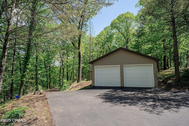 78 Trillium Ln, Danville, PA 17821 - detached garage featuring a view of trees
