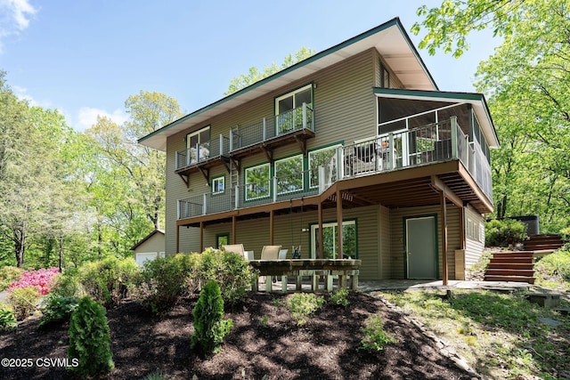 78 Trillium Ln, Danville, PA 17821 - rear view of house with stairs, a wooden deck, and a patio area