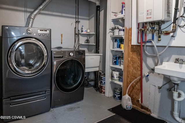78 Trillium Ln, Danville, PA 17821 - clothes washing area with washer and clothes dryer and tankless water heater