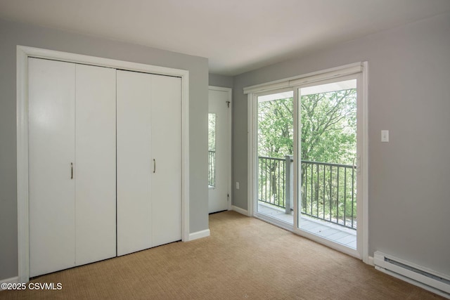 78 Trillium Ln, Danville, PA 17821 - unfurnished bedroom with a baseboard heating unit, access to exterior, carpet, a closet, and baseboards
