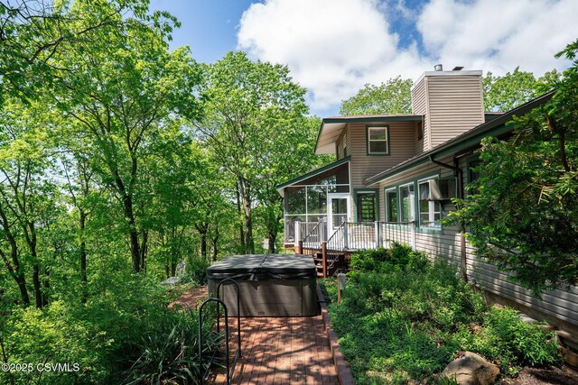 78 Trillium Ln, Danville, PA 17821 - deck featuring a hot tub and a sunroom