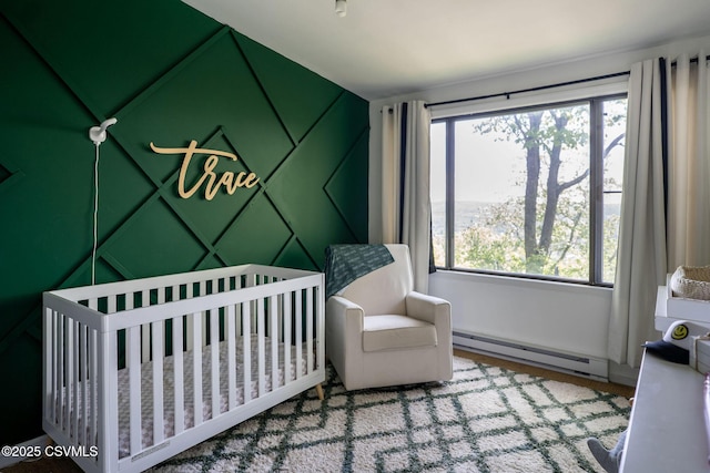 78 Trillium Ln, Danville, PA 17821 - bedroom with a baseboard heating unit and a crib