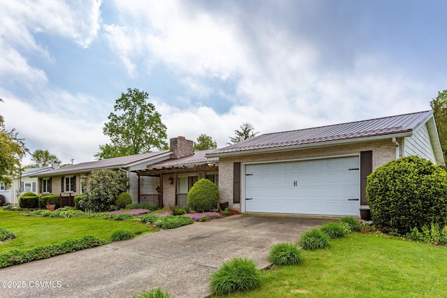 ranch-style home featuring brick siding, metal roof, concrete driveway, a garage, and a front yard