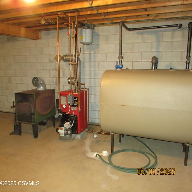 unfinished basement featuring heating fuel and a heating unit