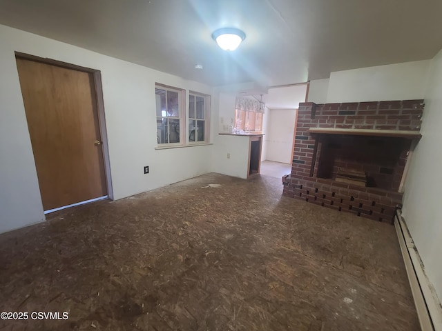 unfurnished living room with baseboard heating and a fireplace