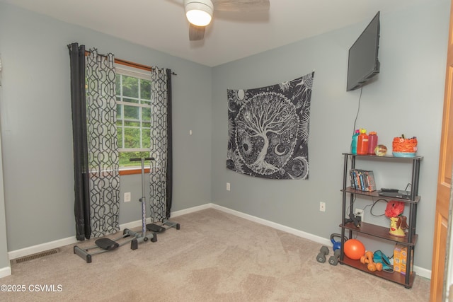 game room with carpet, ceiling fan, and baseboards