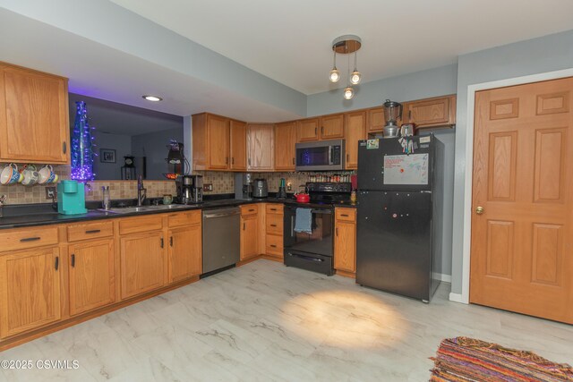 kitchen featuring black appliances, a sink, dark countertops, and tasteful backsplash